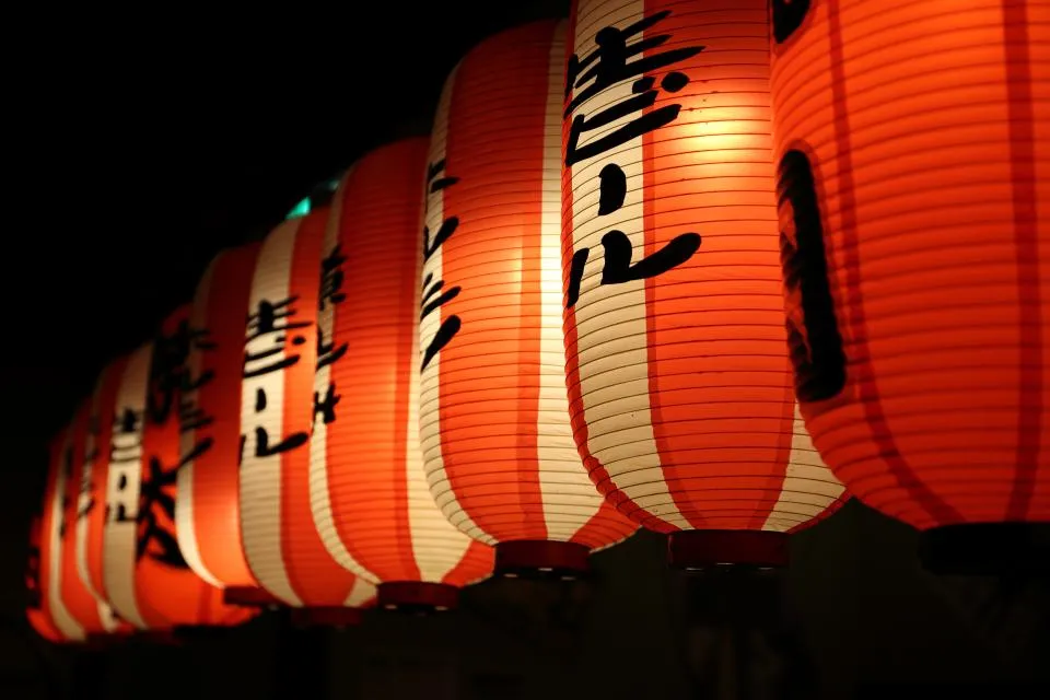Paper lanterns glowing at night